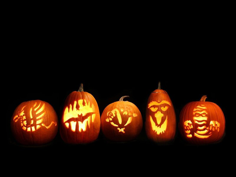 carved pumpkins in a row