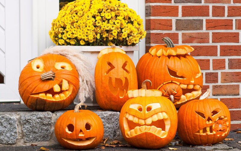 Carved pumpkins on porch
