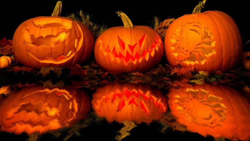 carved pumpkins with reflections
