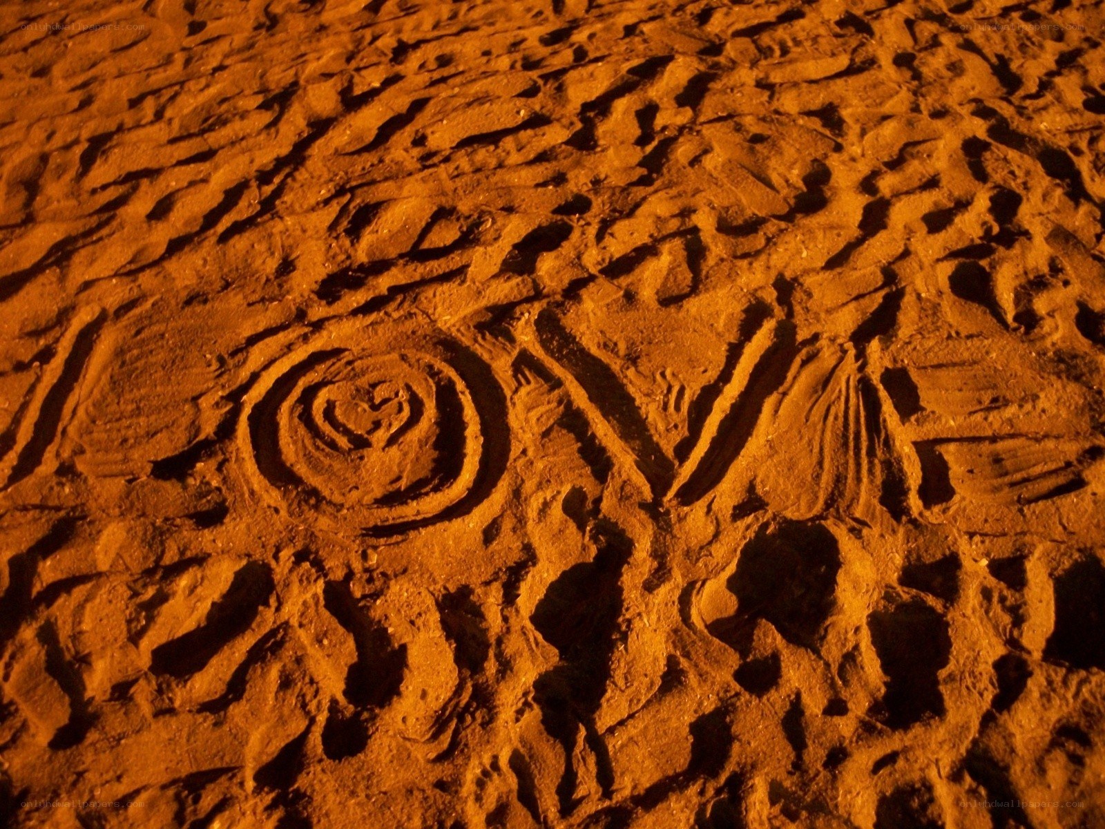 carved sand patterns at night