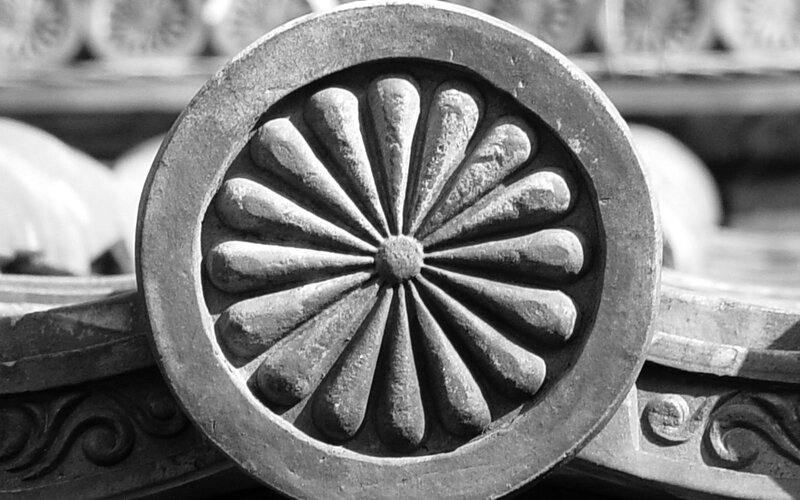 Carved Stone Emblem — Black