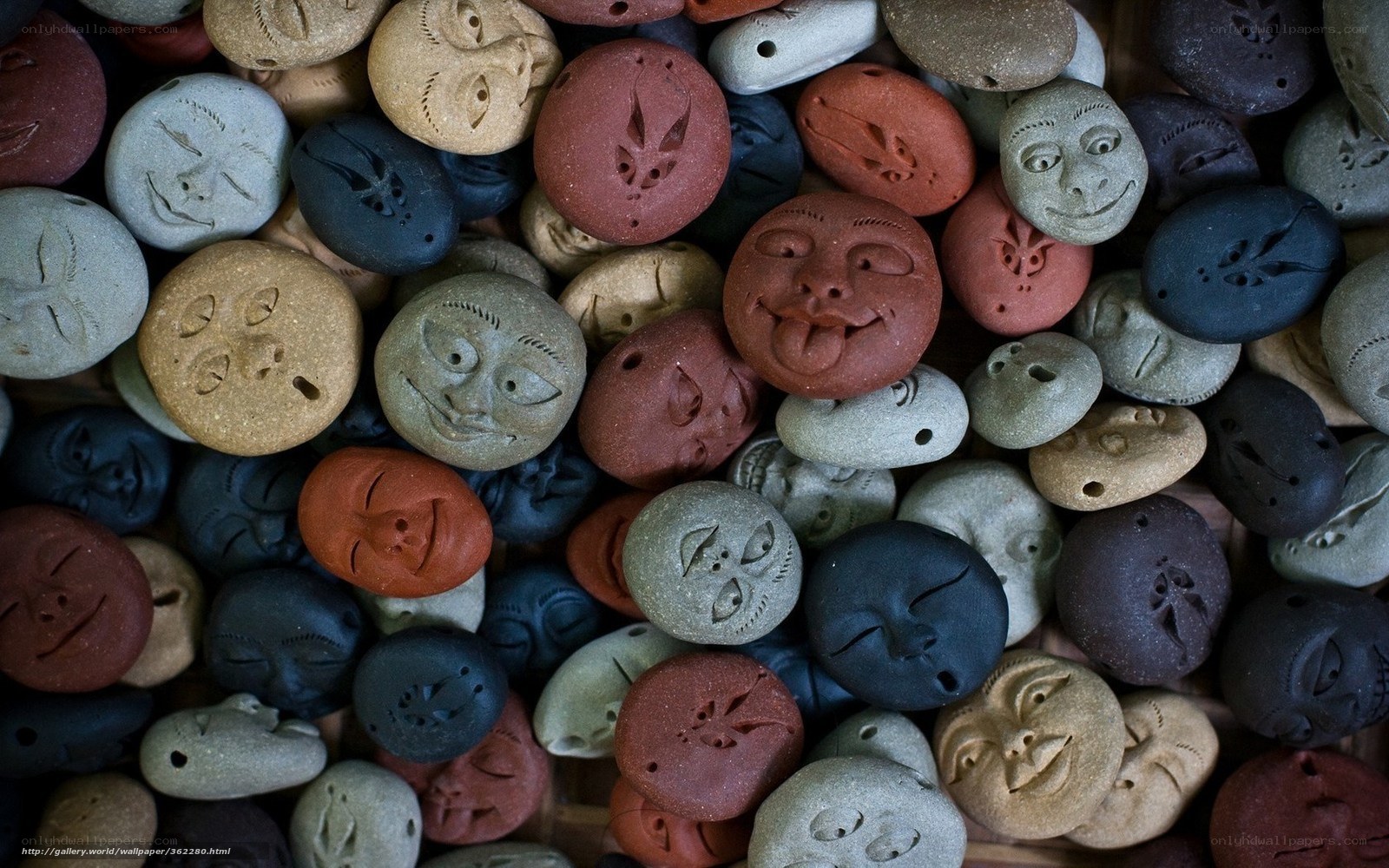 Carved stone face tokens