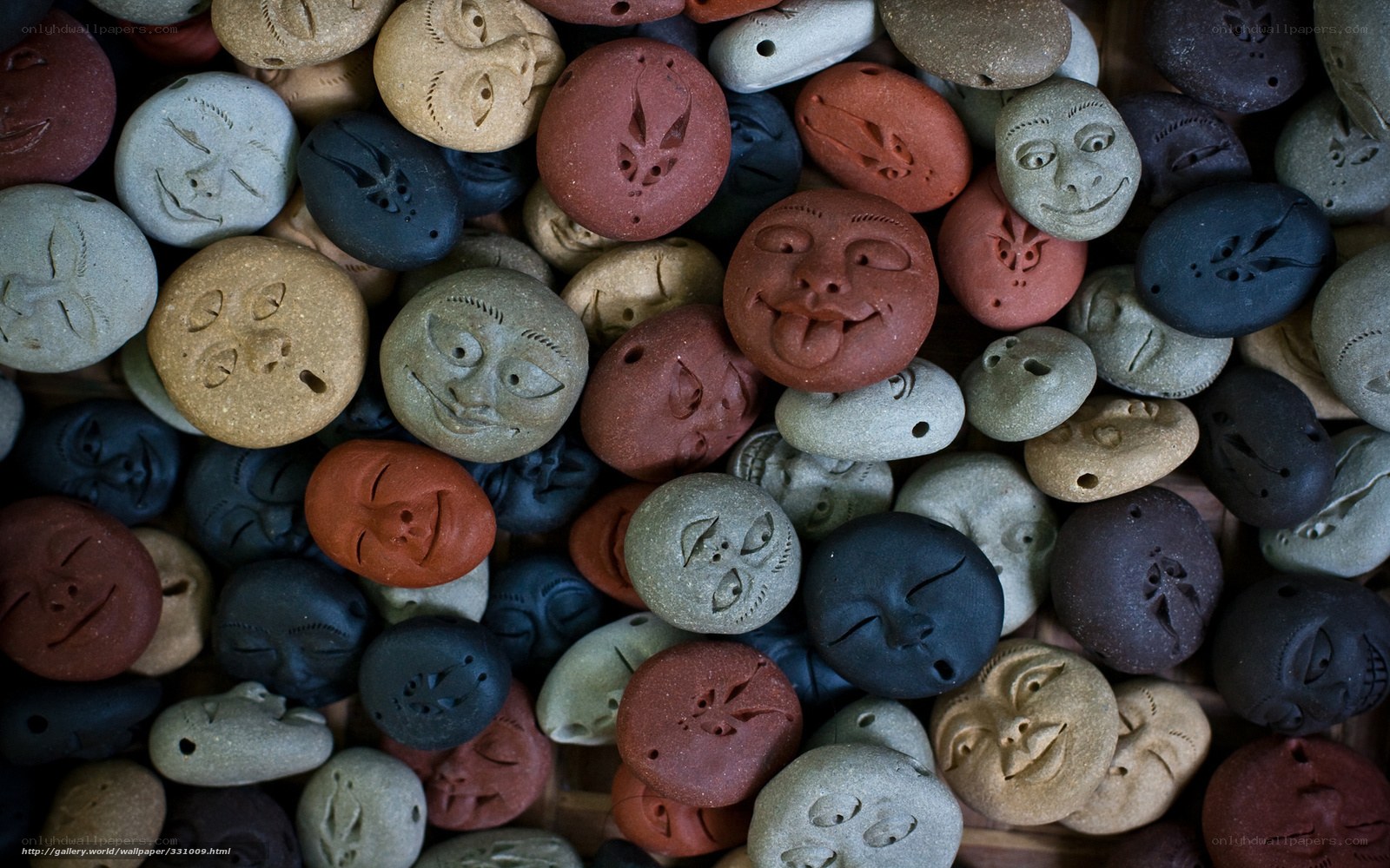 Carved stone face tokens