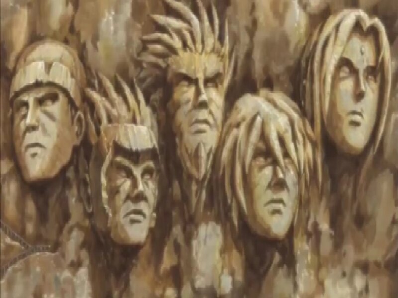 Carved Stone Faces — Brown, Dramatic