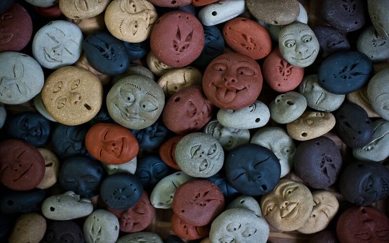 Carved Stone Faces — Brown