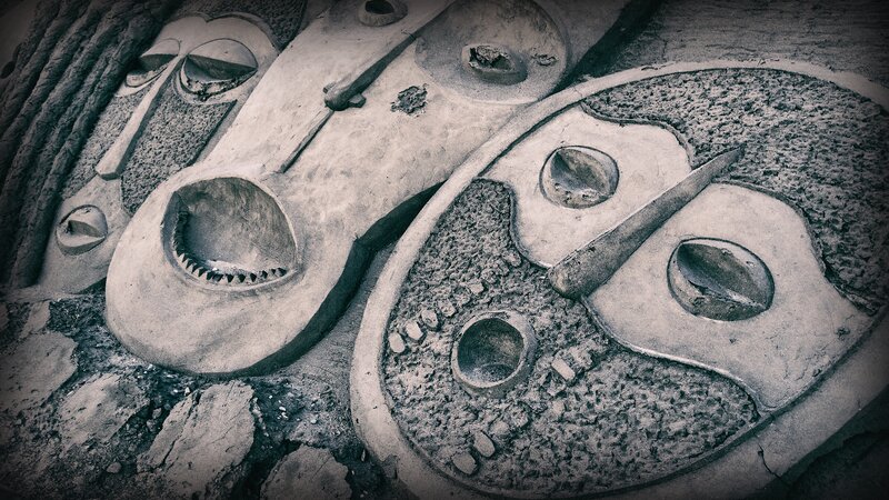 Carved Stone Faces — Gray