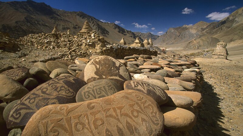 Carved stones in mountain valley