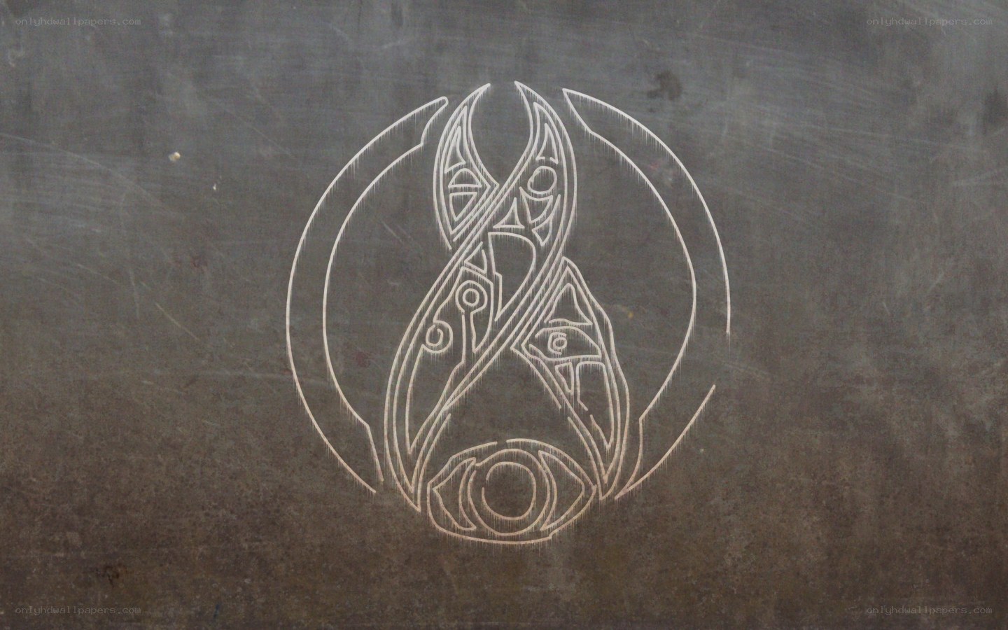 carved symbol on dark surface