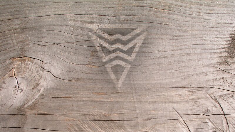 carved symbol on weathered wood