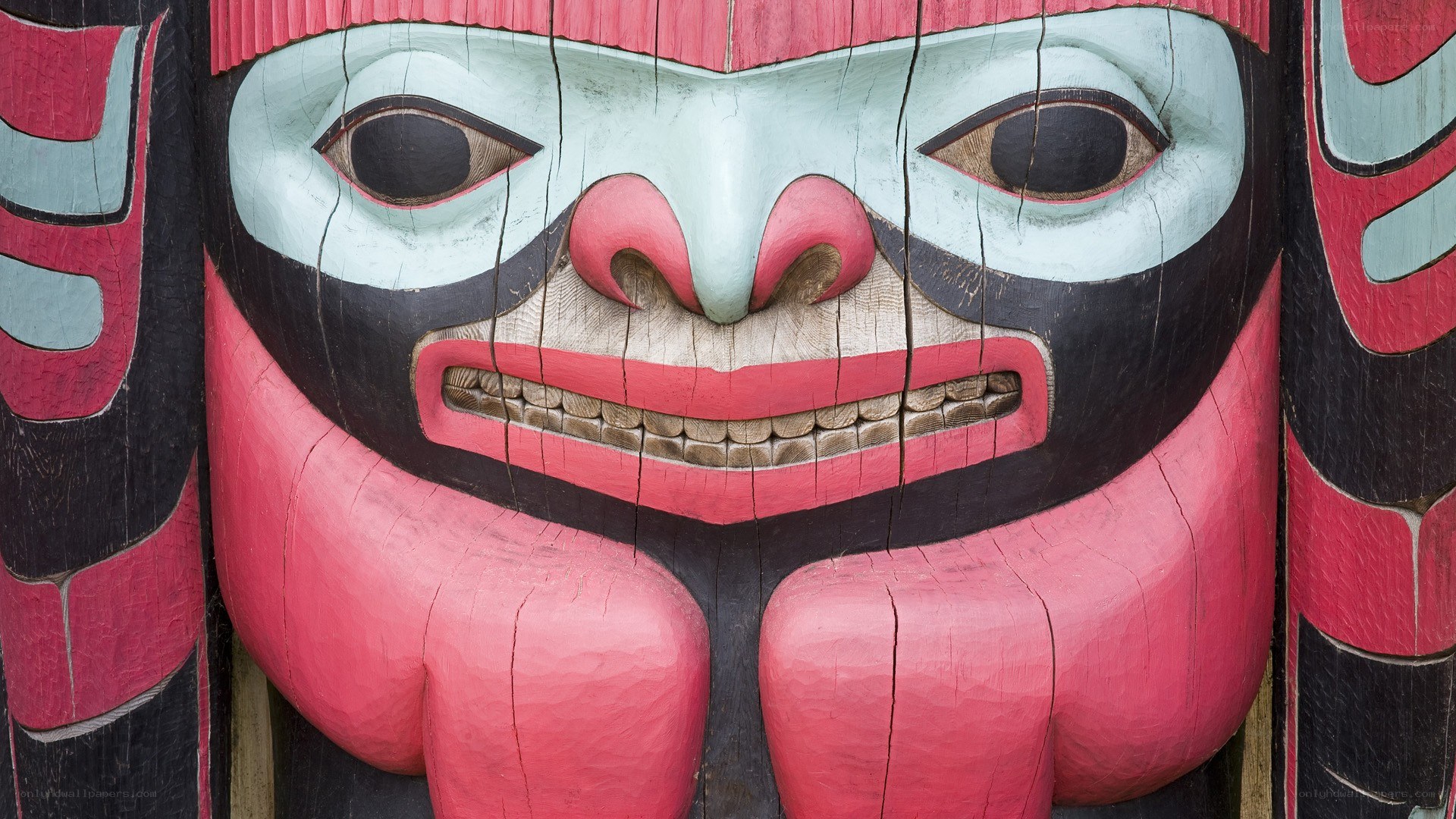 carved totem pole face