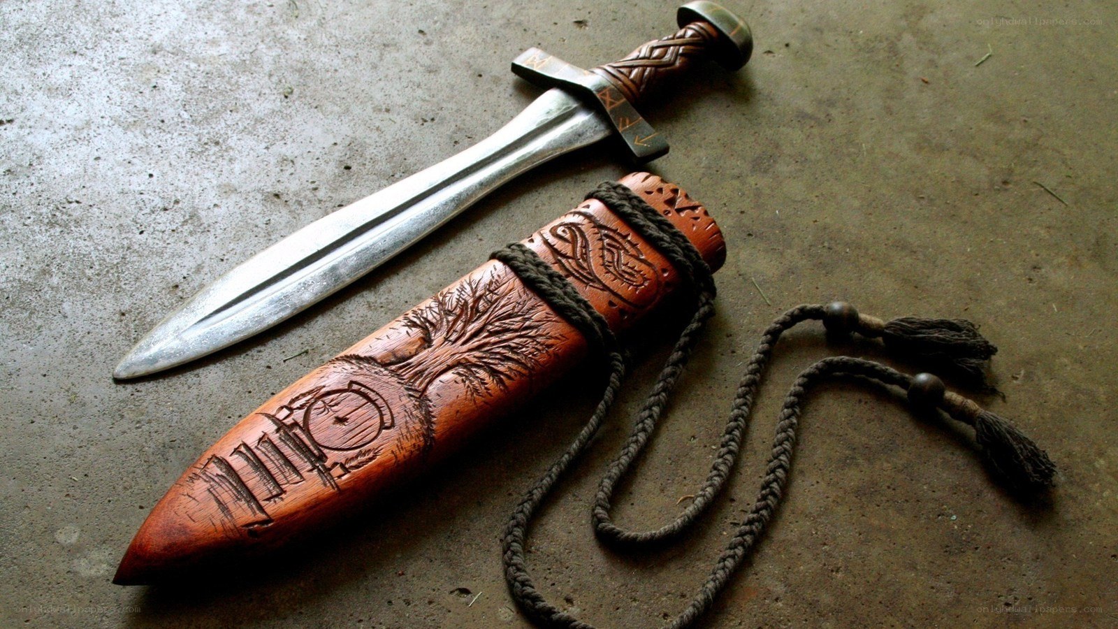 carved wooden dagger sheath