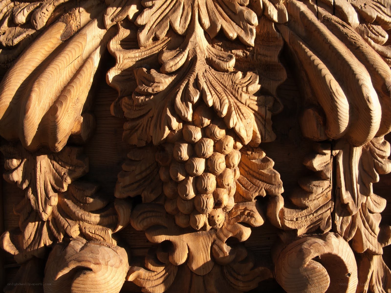 carved wooden grape cluster