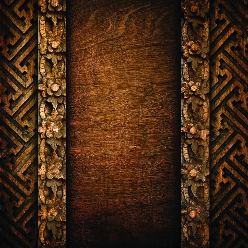 carved wooden panel with floral borders