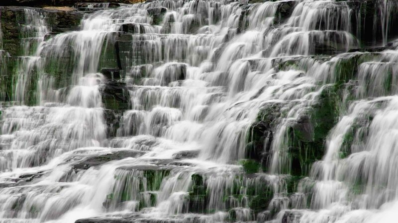 cascading waterfall on rocks