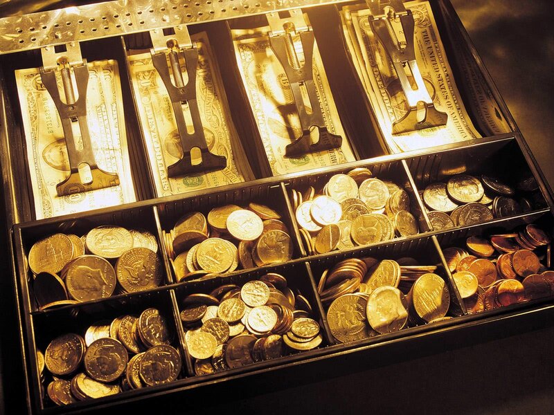 Cash register drawer with money