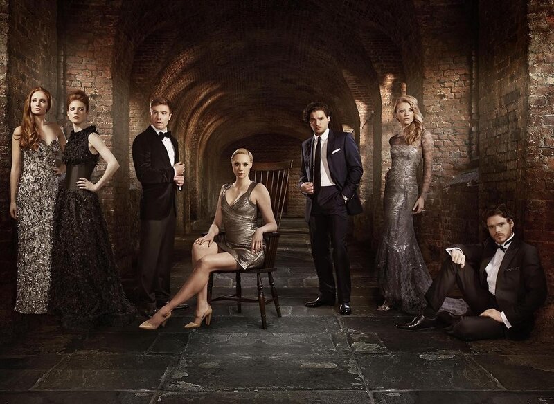Cast in formal wear in a tunnel