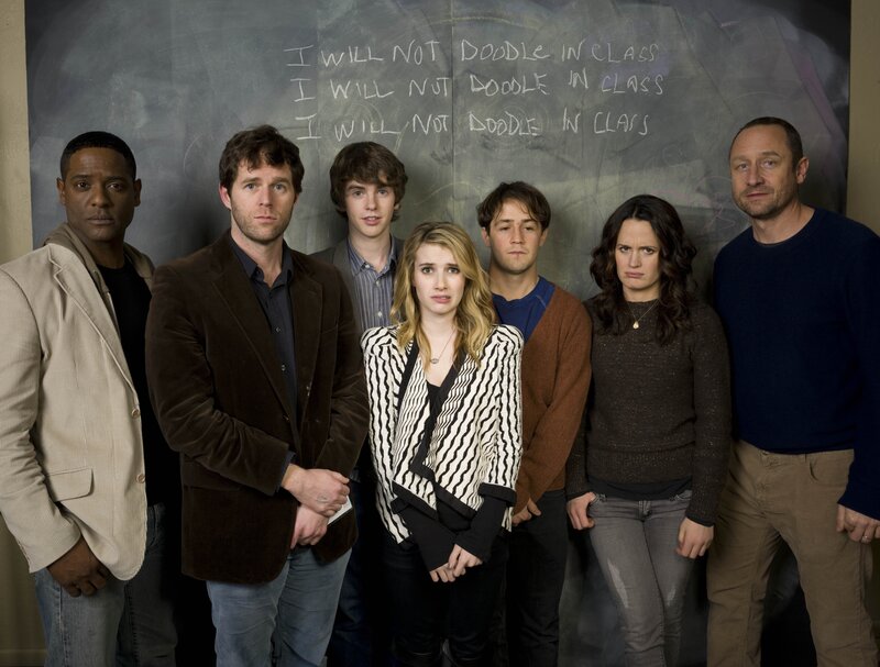 Cast in front of chalkboard