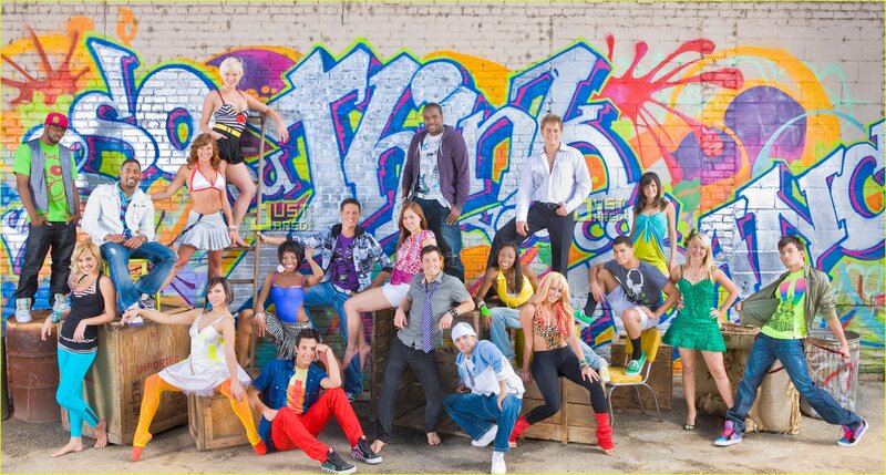 Cast in front of graffiti wall