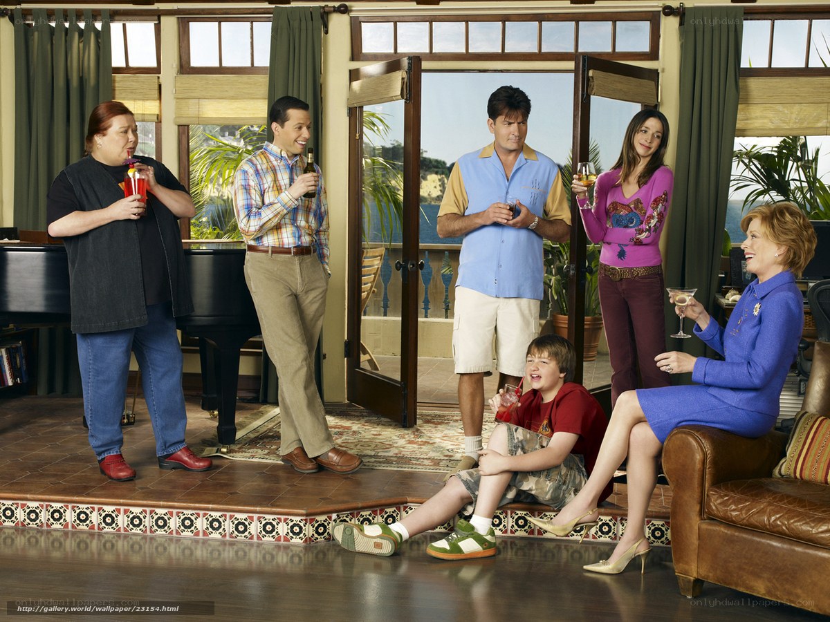 Cast of a sitcom in a living room