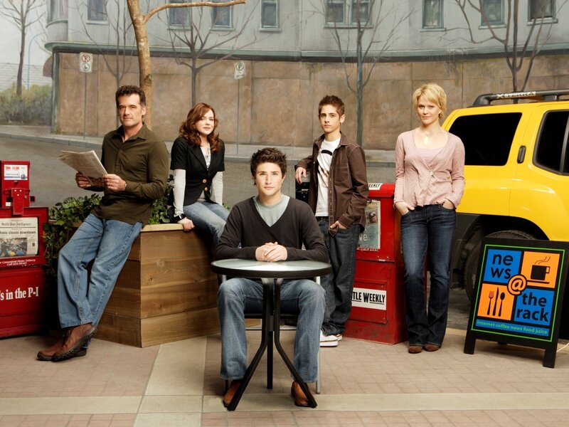 Cast of a TV show on a street set