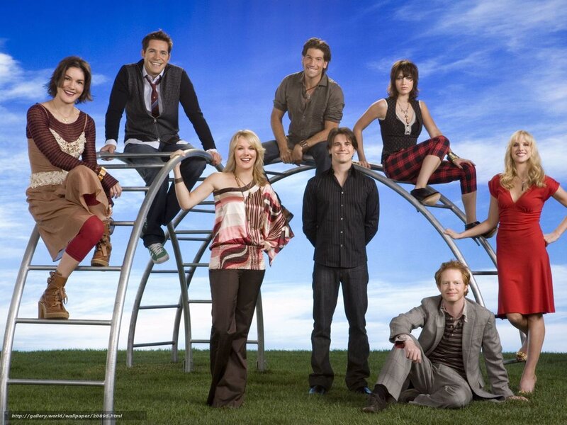 Cast of a TV show on playground equipment