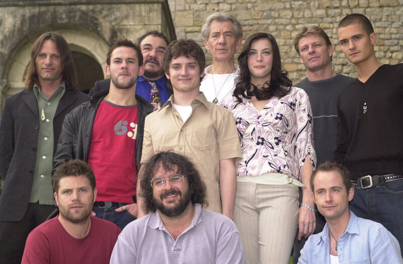cast photo of a group