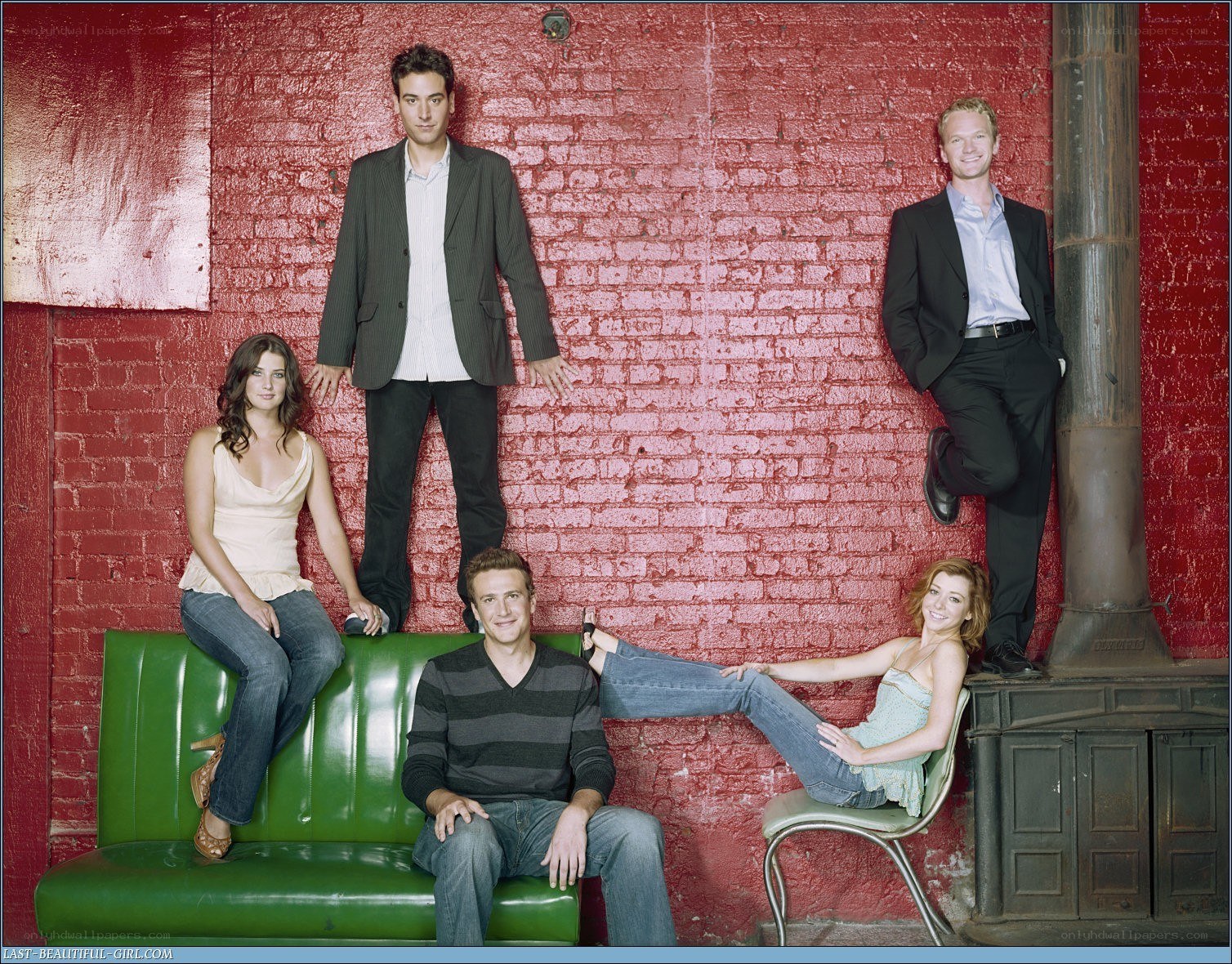 cast photo on green couch