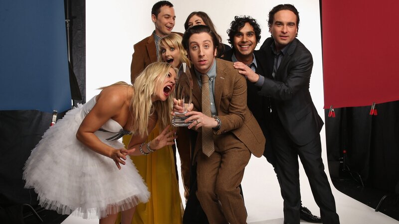 Cast posing with award