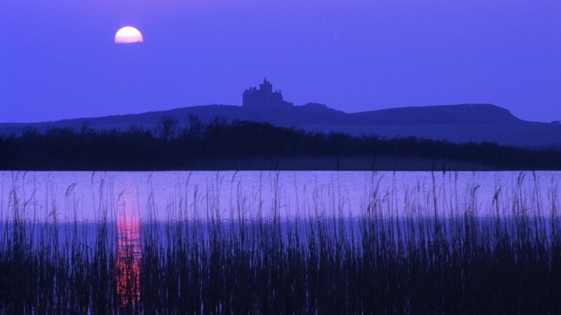 Castle at dusk by the lake