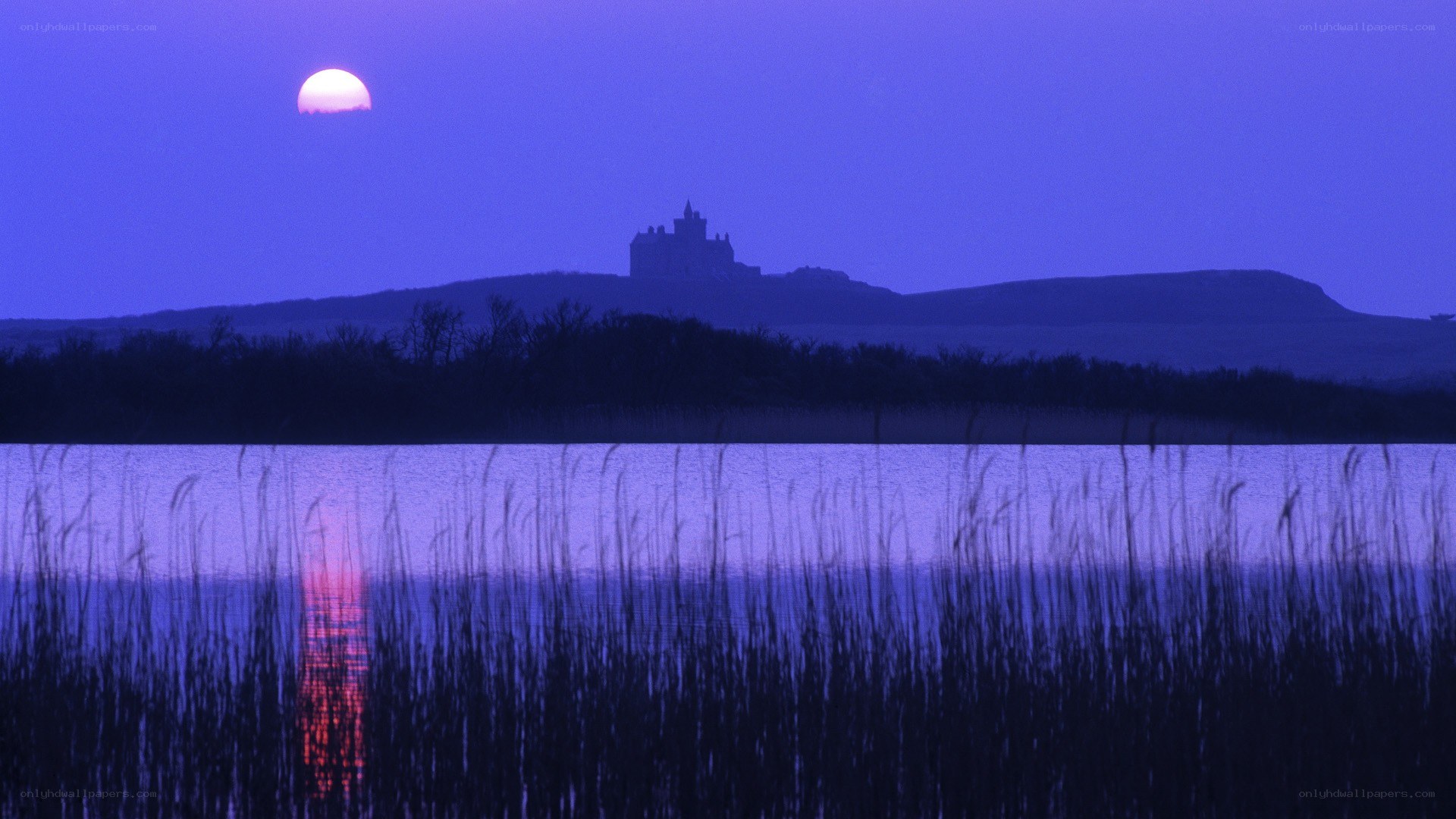 Castle at dusk by the lake
