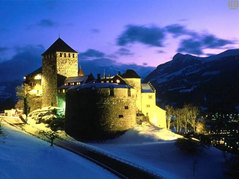 castle at dusk in snowy mountains