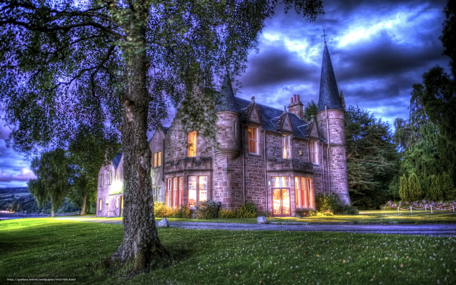 Castle at dusk with glowing windows