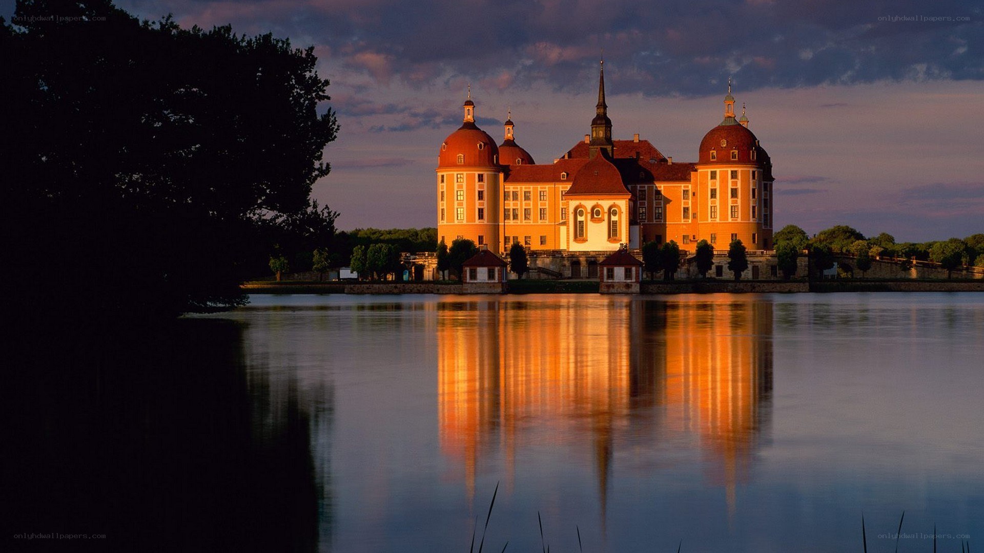 castle at sunset by the lake