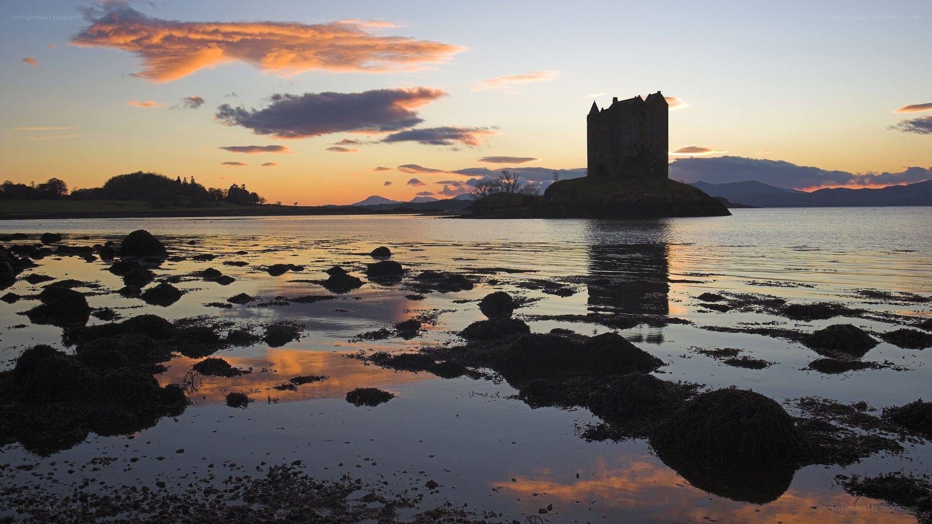 Castle at sunset on a calm lake