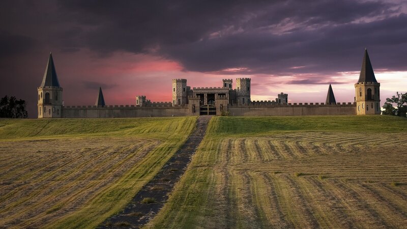 castle at sunset on a hill