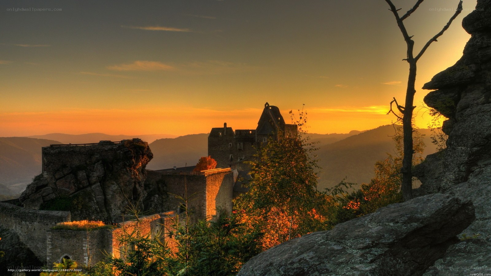 castle at sunset on a hill