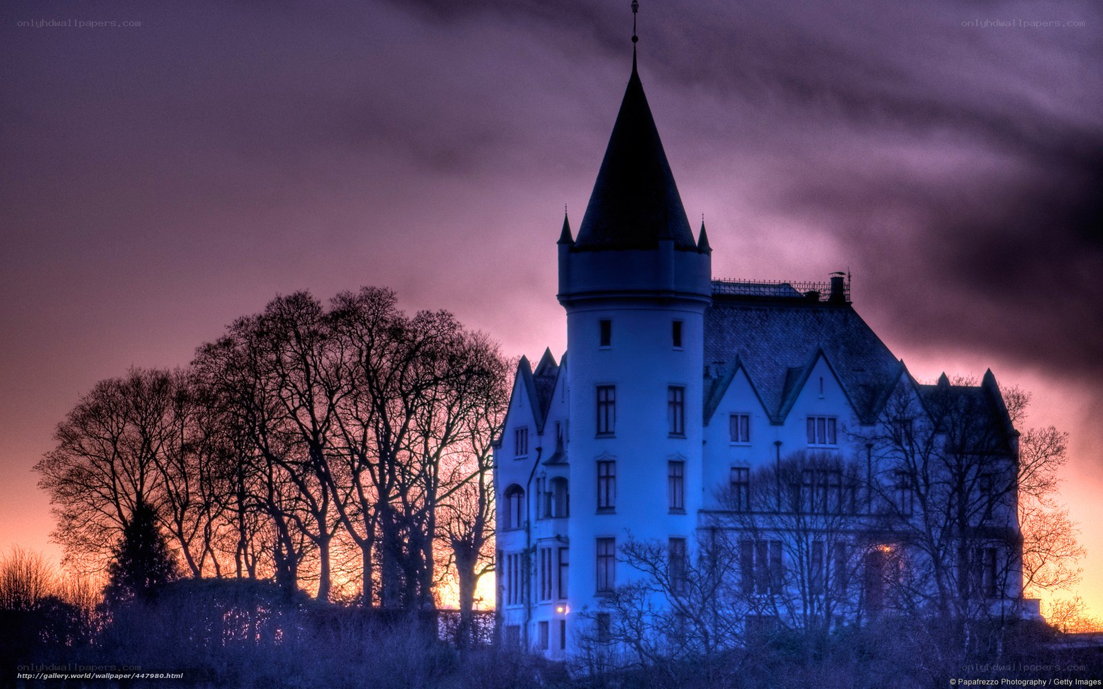 Castle at sunset with purple sky