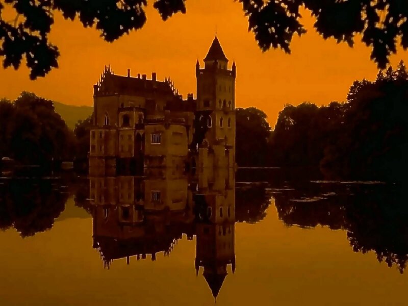 castle at sunset with reflection