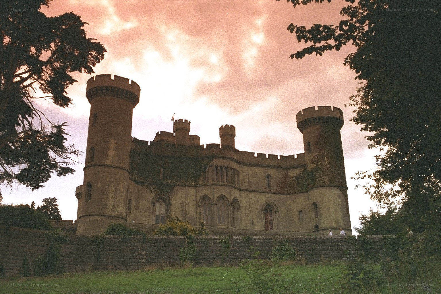 castle at sunset with trees