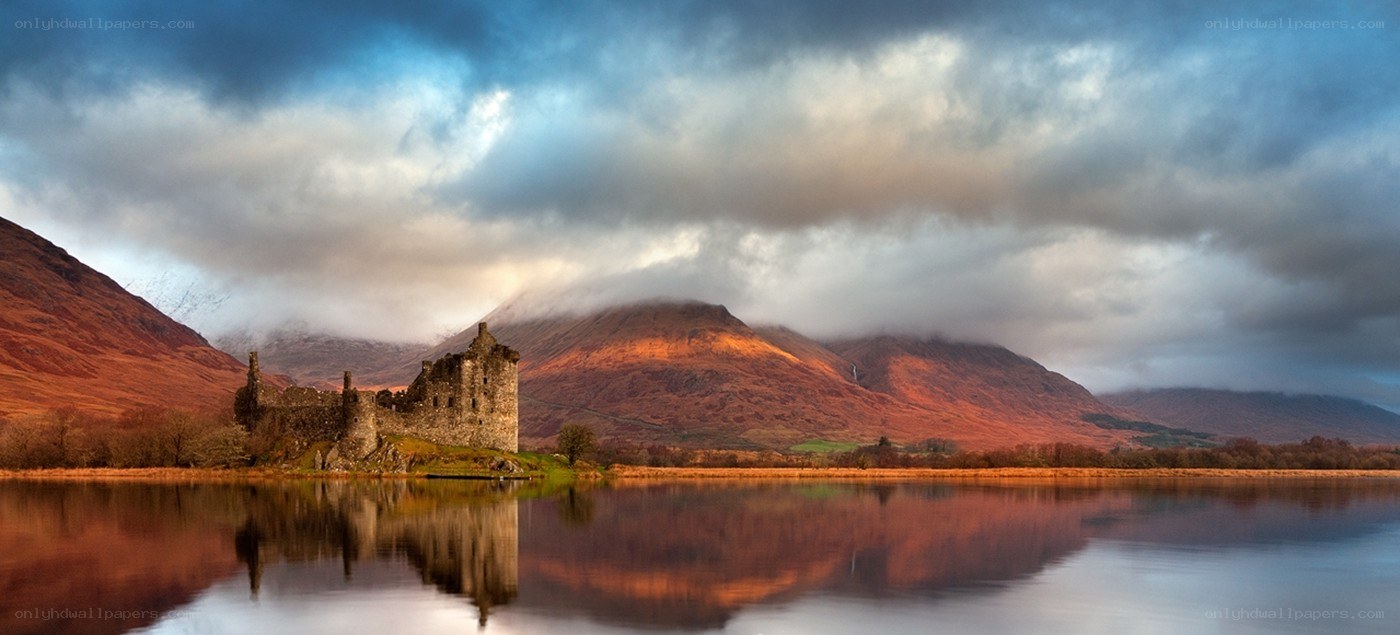 Castle by a lake at sunset
