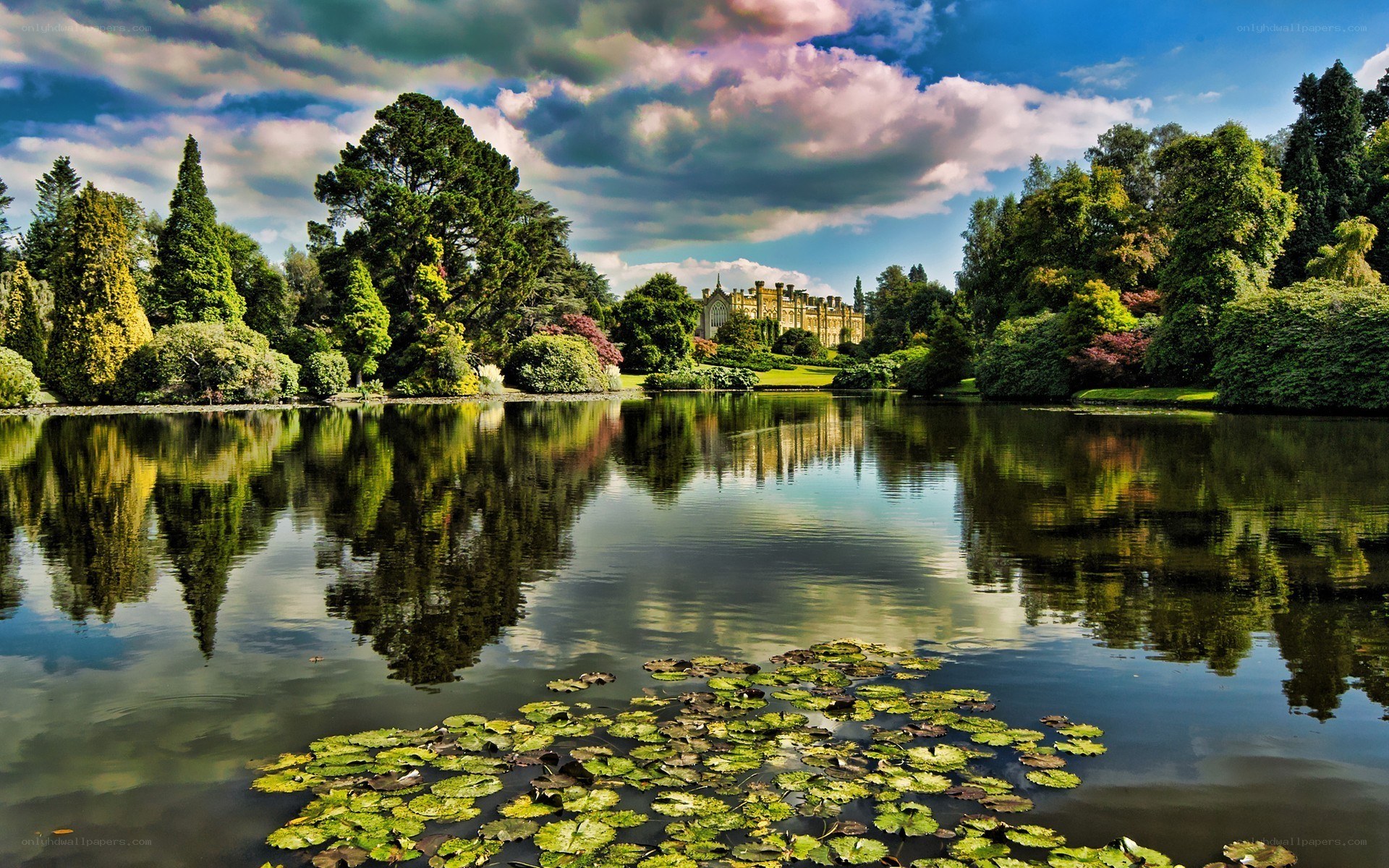 Castle by a lake in a garden