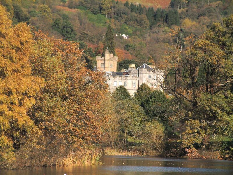 castle by a lake in autumn