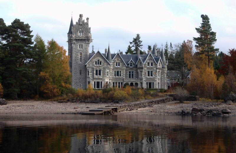 castle by a lake in autumn