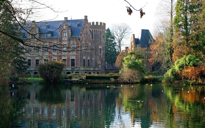 castle by a lake in autumn