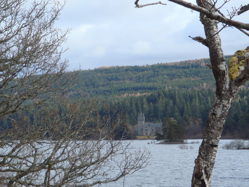 castle by a lake in Scotland