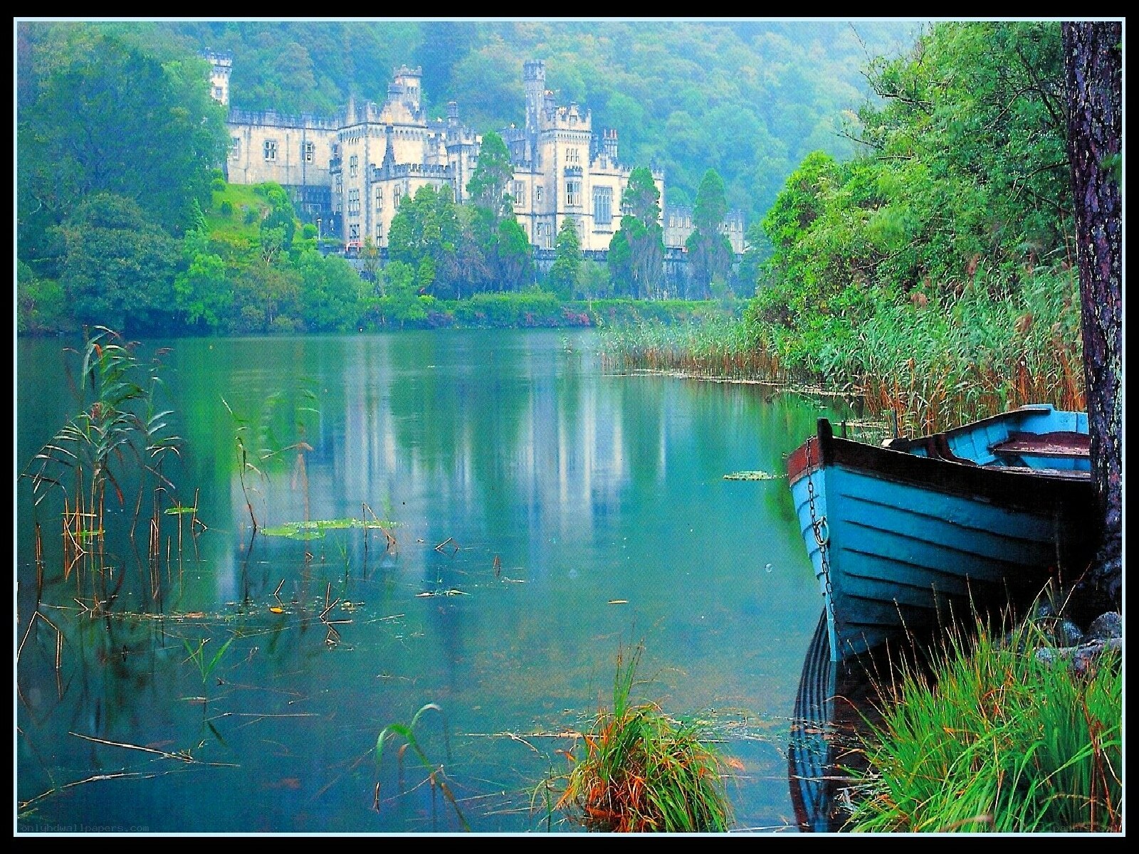 Castle by a lake with boat