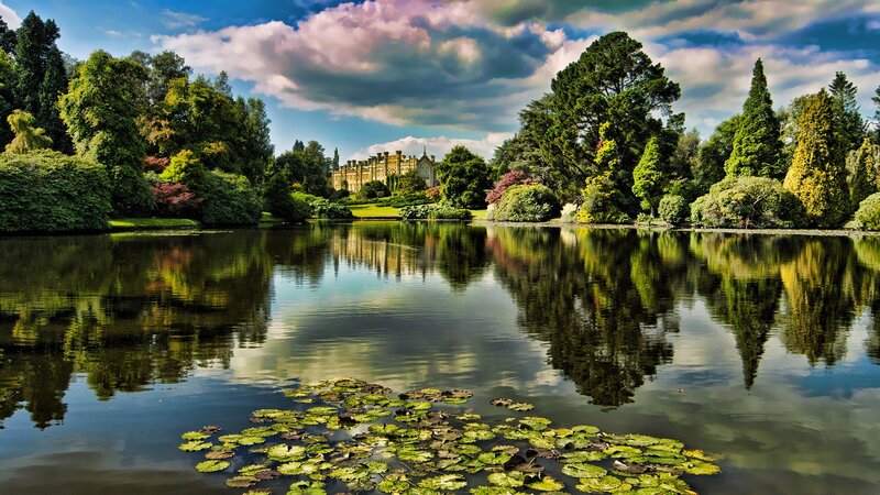 Castle by a lake with lily pads