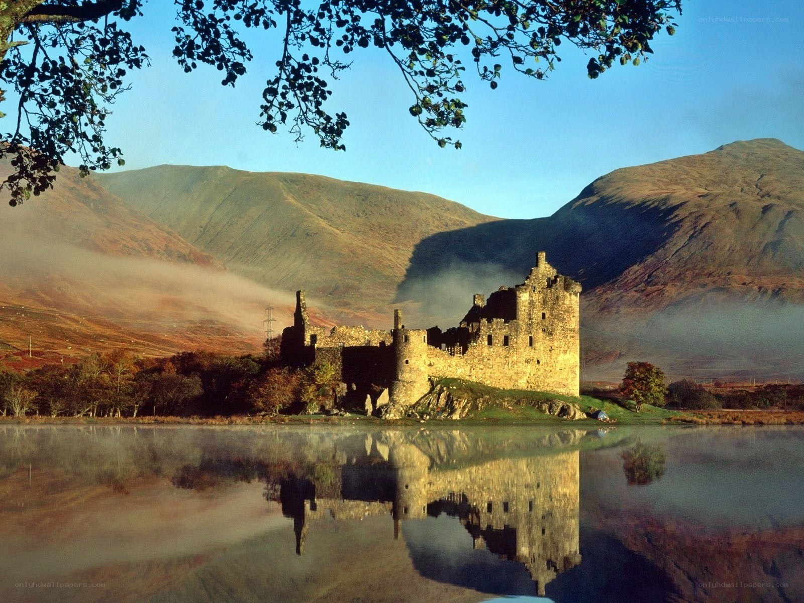 Castle by a misty lake