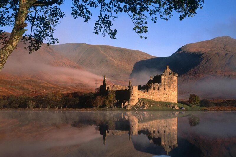 Castle by a misty lake