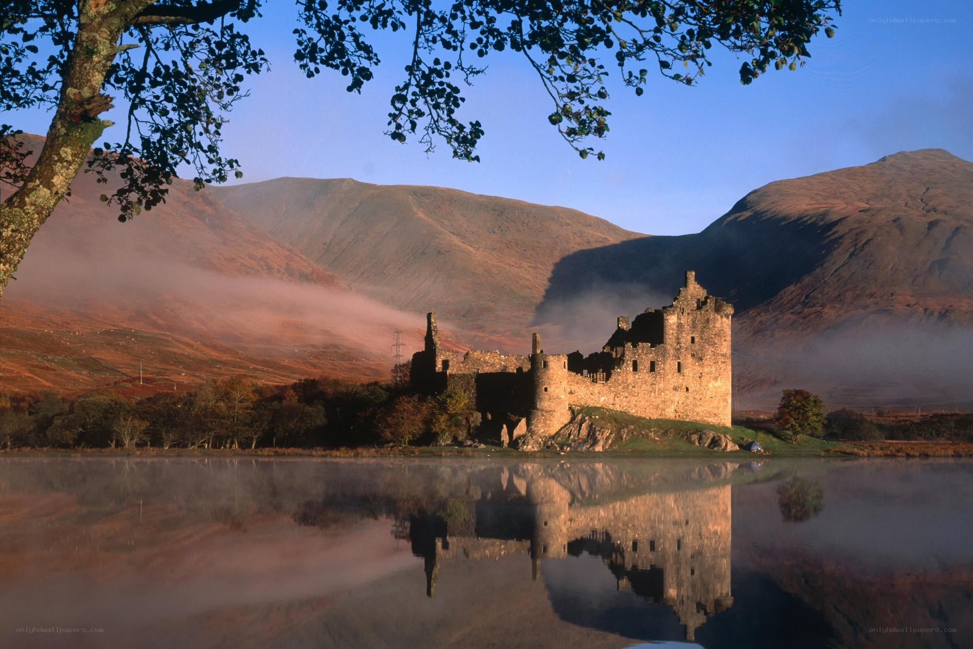 Castle by a misty lake